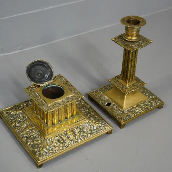 ornate figured brass items - candlestick with hole in base H-200 and an inkwell