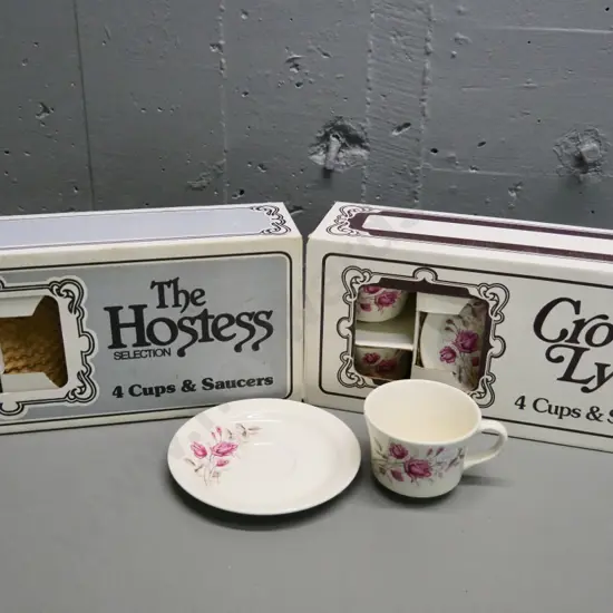 2 as-new sets of 4 Crown Lynn rose pattern cups & saucers in original boxes