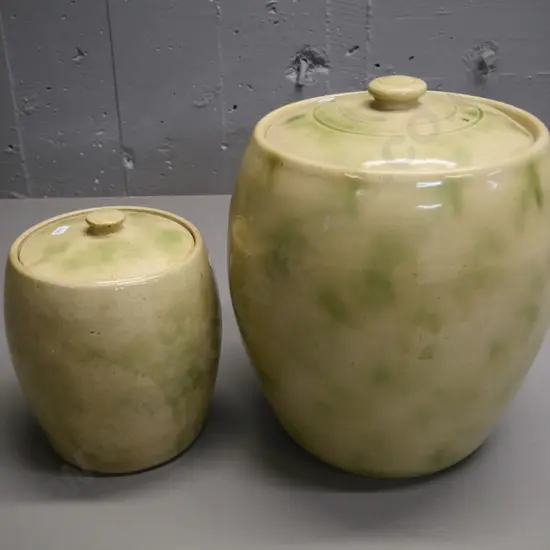 2 mottled green & cream lidded crocks - larger is marked Timaru Potteries inside, H-320 D-250, has small chip to lid rim