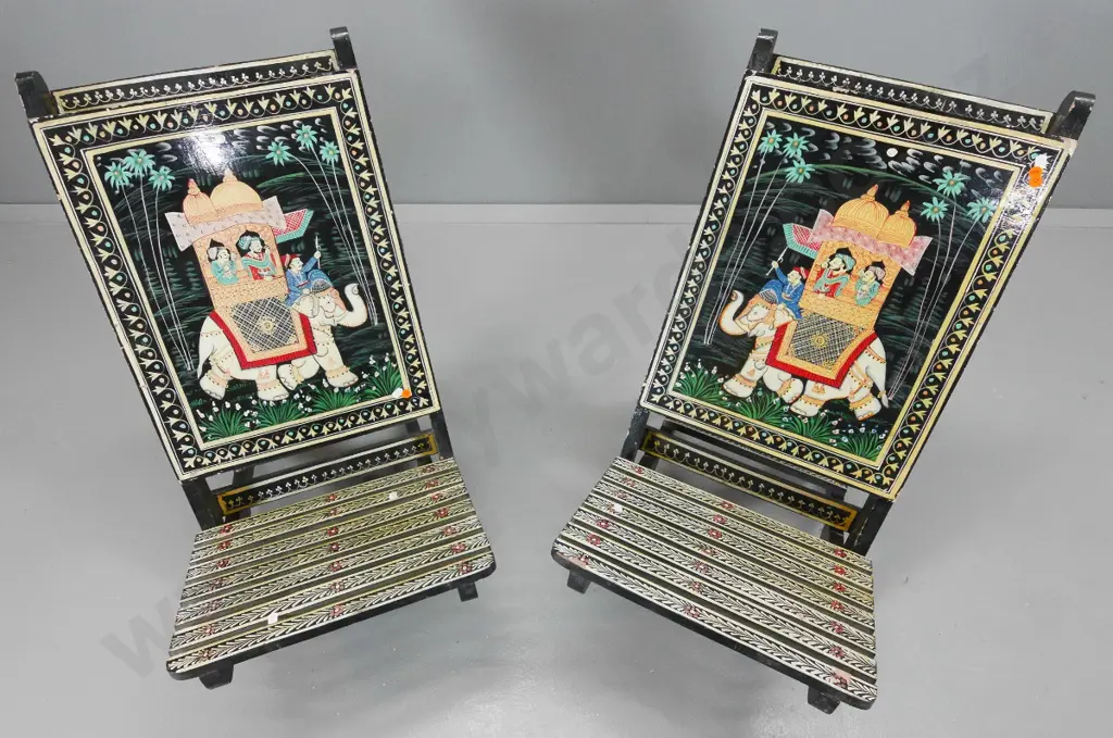 pair of collapsible Indian chairs with elephant motif painted backs, some chipping to paint H730 W410 D640 Image 1++