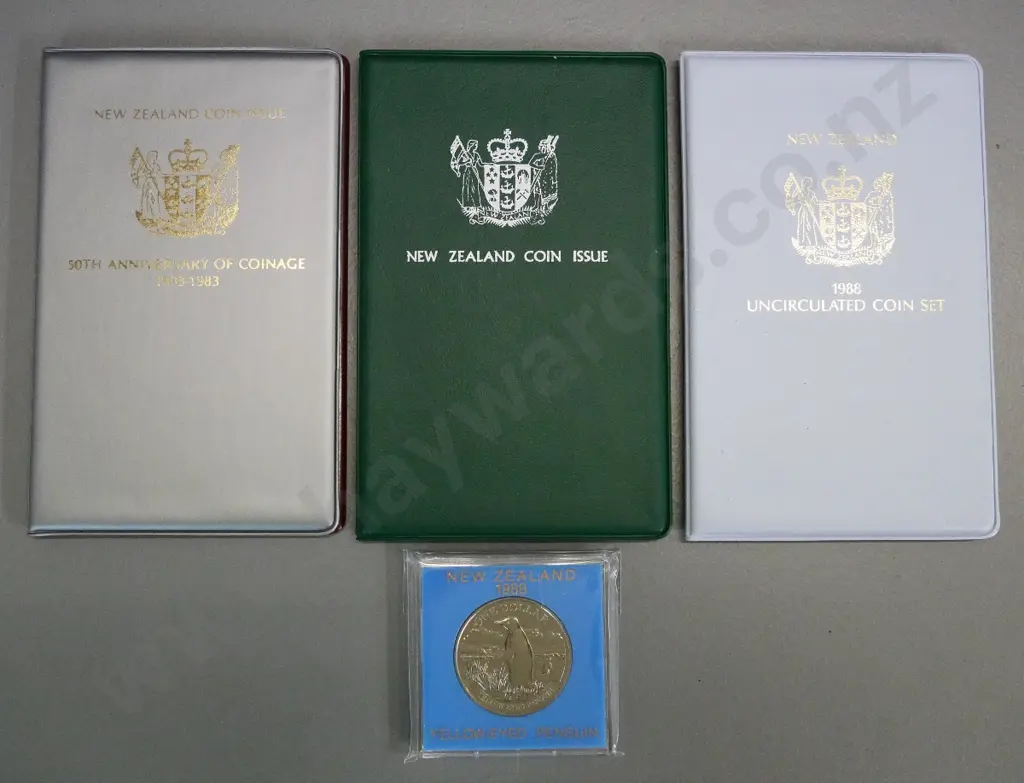 3 New Zealand cased collector coin sets - 1980, 1983, 1988 - and a Yellow Eyed Penguin dollar Image 1++