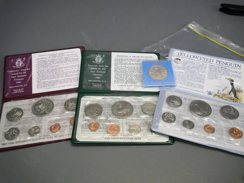 3 New Zealand cased collector coin sets - 1980, 1983, 1988 - and a Yellow Eyed Penguin dollar Image 1++