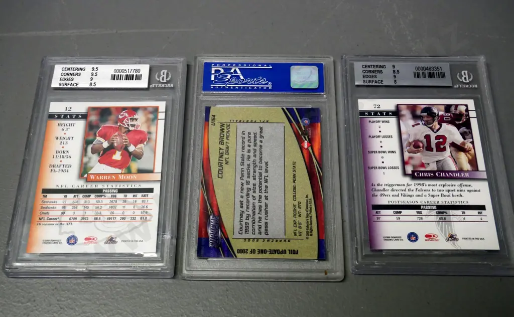 3 encased graded vintage NFL collector's cards - Chris Chandler, Warren Moon, Courtney Brown - slight damage to 1 case Image 1++