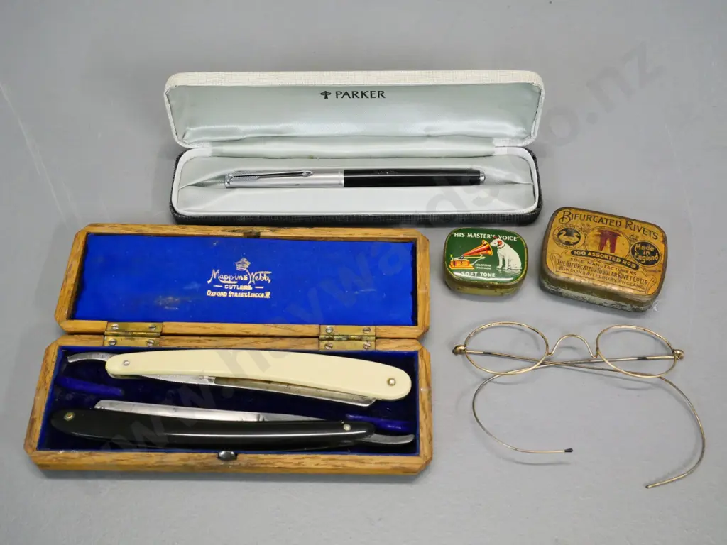 two straight razors in fitted wooden case, vintage spectacle frames, Parker fountain pen, gramophone needles in tin etc. Image 1++