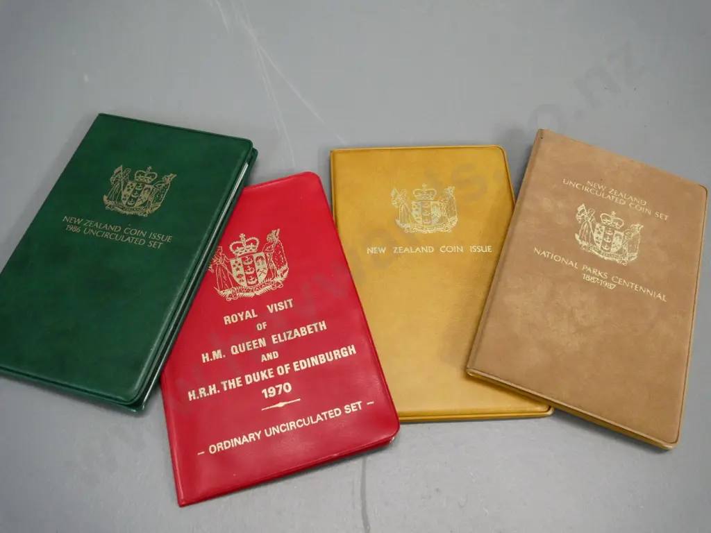 4 New Zealand cased collector coin sets - 1970 Royal Visit, 1985 & 1986 (Kakapo dollar) 1987 National Parks Image 1++