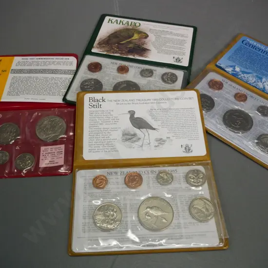 4 New Zealand cased collector coin sets - 1970 Royal Visit, 1985 & 1986 (Kakapo dollar) 1987 National Parks