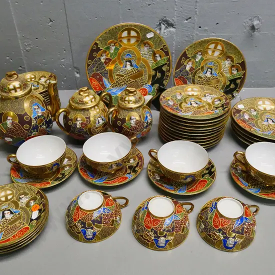 large quantity of Chinese 'lithophane' teaware - 7 trios, teapot, cream & sugar, assorted plates and numerous saucers
