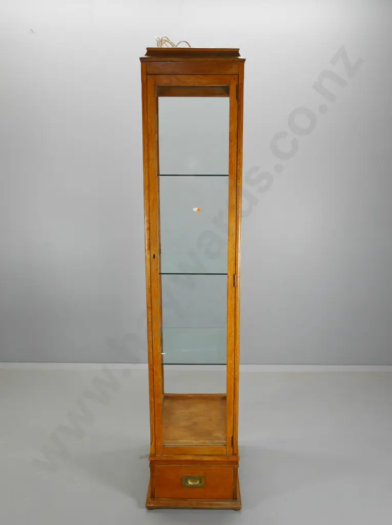 tall oak single door illuminated display cabinet glazed all sides, drawer w/brass campaign handles H1960 W390 D490 Image 1++