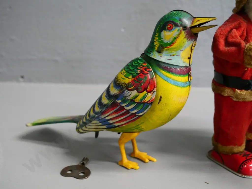 2 vintage wind-up toys - book-turning Santa in working order & bird, not working, key doesn't quite fit, slight damage Image 1++