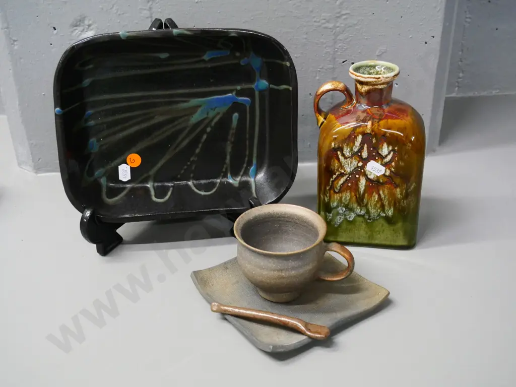 3 studio pottery items - baking dish, handled flask H-180 and a cup & saucer with spoon Image 1++