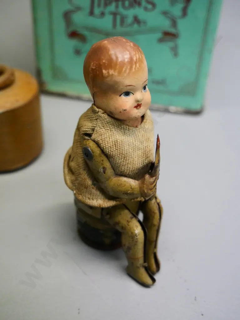 small German mechanical toy with celluloid head, no key, 2 Lipton's tea tins, 1 has contents, stoneware ink bottle Image 1++
