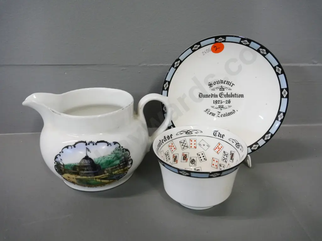 2 pieces of 1925-26 Dunedin Exhibition ware - fortune teller cup & saucer and a jug H-90 W-140 Image 1++