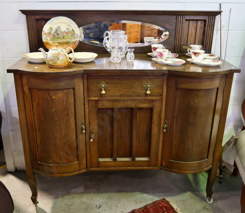 deco oak 3-door single drawer sideboard w/brass drop handles, oval bevelled mirror in upstand, keys H1350 W1370 D560 Image 1++