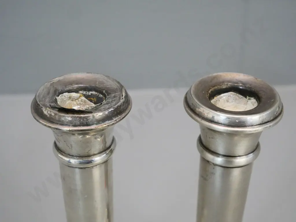 pair of small sterling silver candlesticks - one has damage to rim H-160 Image 1++