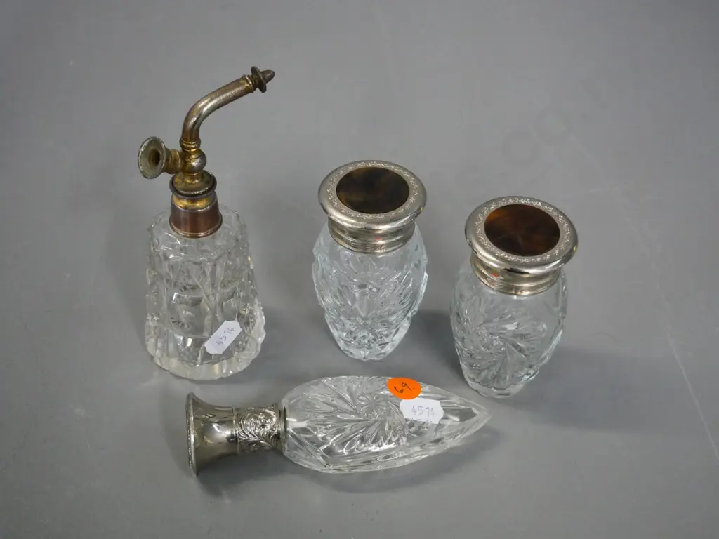 4 depression glass perfume bottles, one with atomiser, others with bakelite & silver plated caps Image 1++