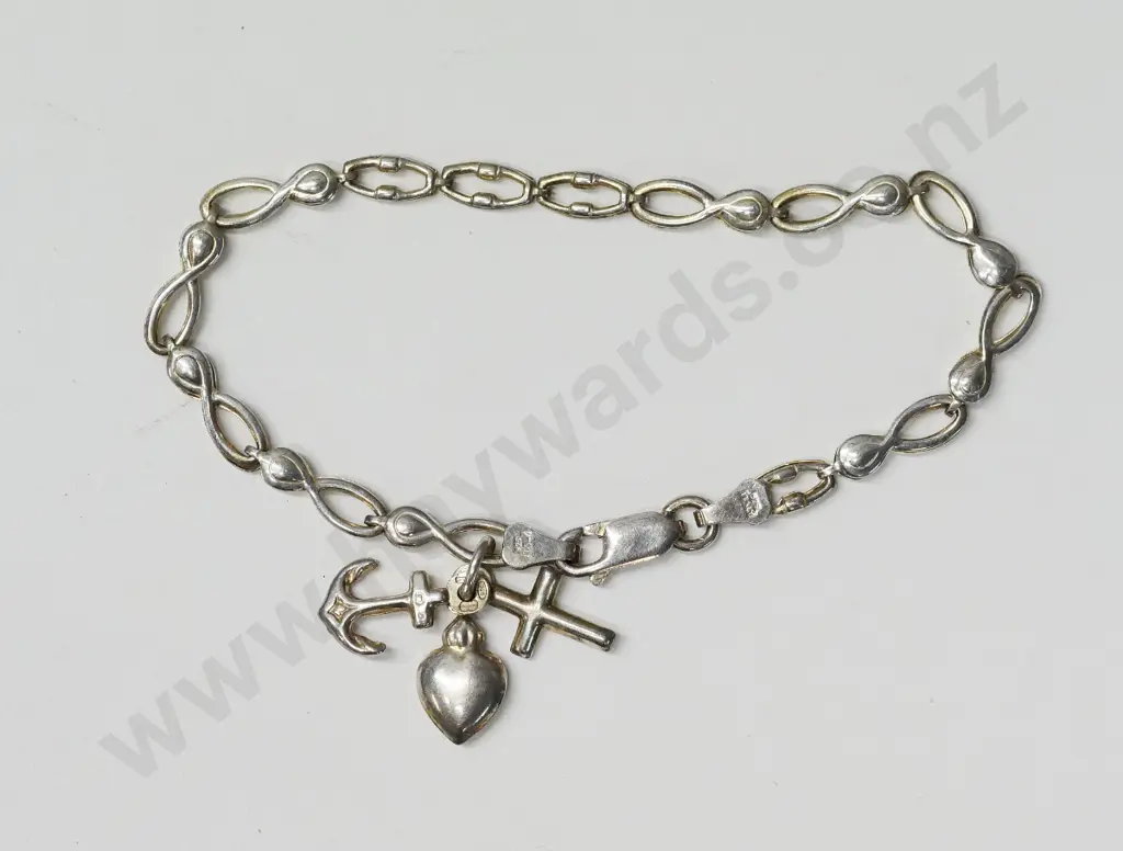 silver bracelet with small heart, cross & anchor stamped 925 Italy Image 1++