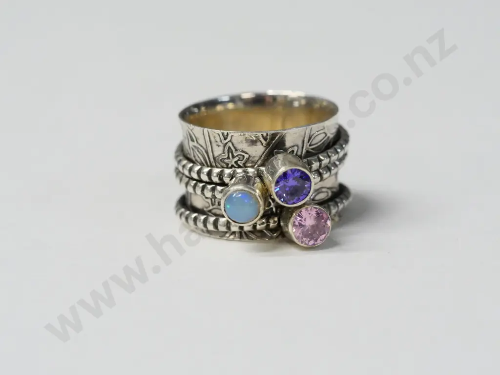 silver ring with 3 rings with opal, amethsyt & pink stones stamped 925 Image 1++