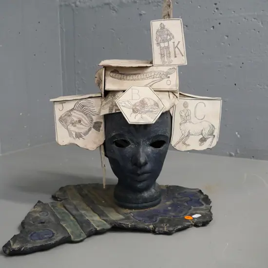 ceramic sculpture, marked WLS on base - head with ceramic alphabet stamp 'cards' H-440 W-370