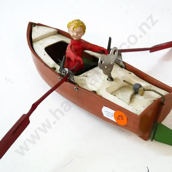 wind-up metal and plastic toy mechanical boat - going
