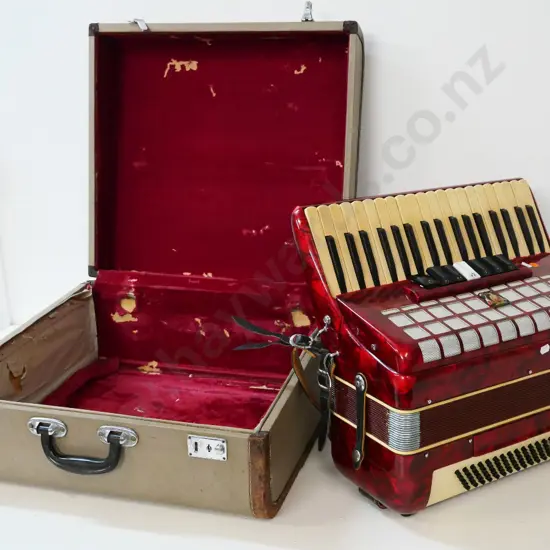 Parrot piano accordion with hard case - case has wear and tear