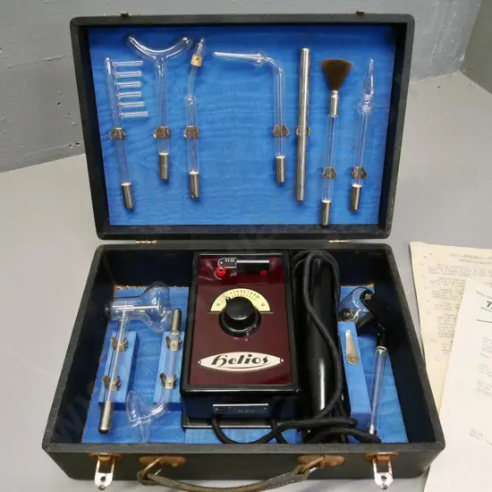 Helios "Violet Ray" therapeutical device with assorted glass attachments in fitted case H100 W330 D230