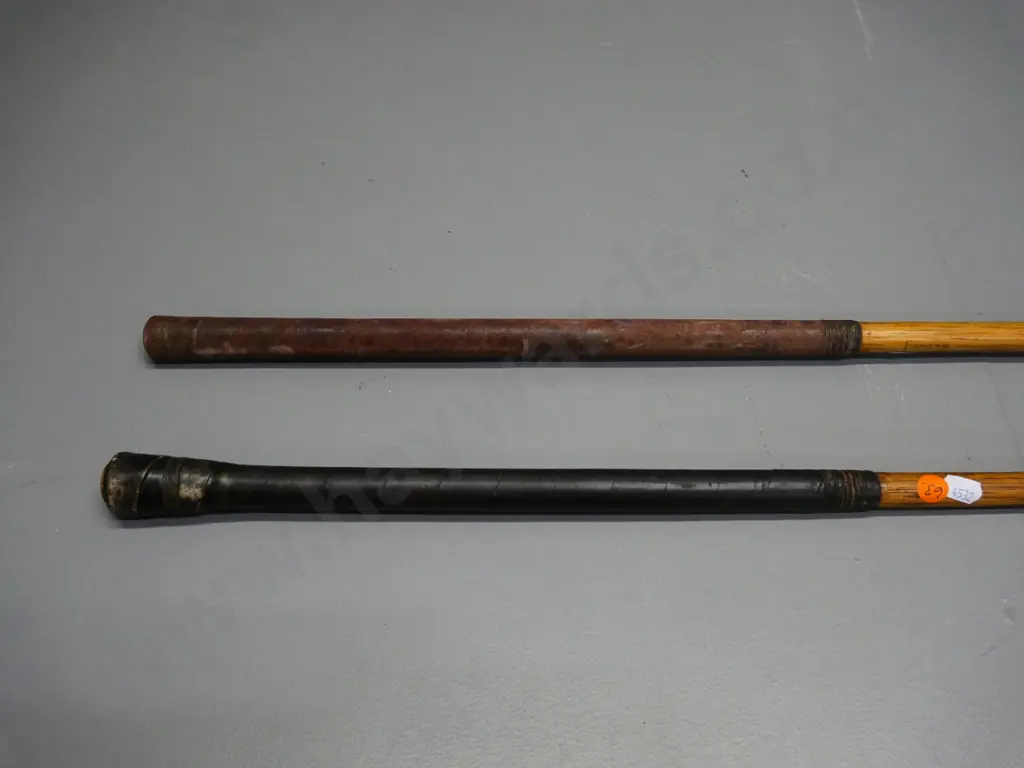2 vintage golf clubs with wooden stems and leather grips Image 1++