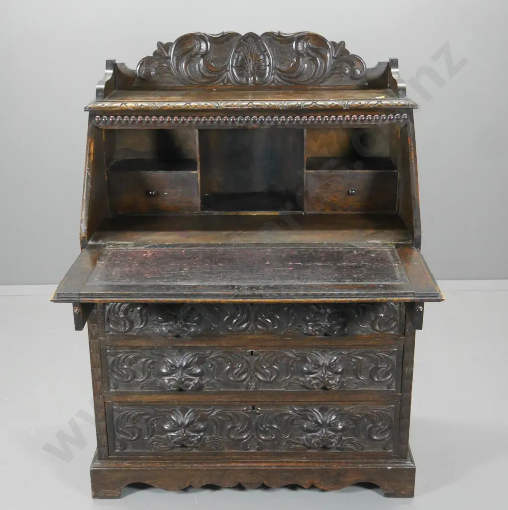 vintage heavily carved Tudor style oak drop-front 4-drawer desk, handle missing from 1 slide H1240 W890 D470 Image 1++