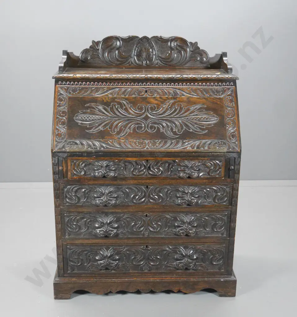 vintage heavily carved Tudor style oak drop-front 4-drawer desk, handle missing from 1 slide H1240 W890 D470 Image 1++