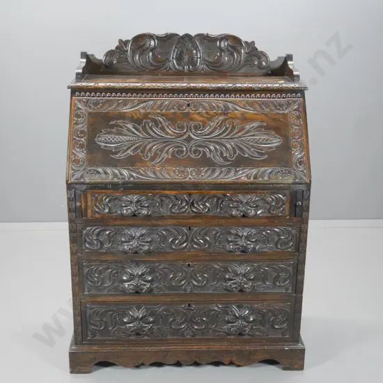 vintage heavily carved Tudor style oak drop-front 4-drawer desk, handle missing from 1 slide H1240 W890 D470