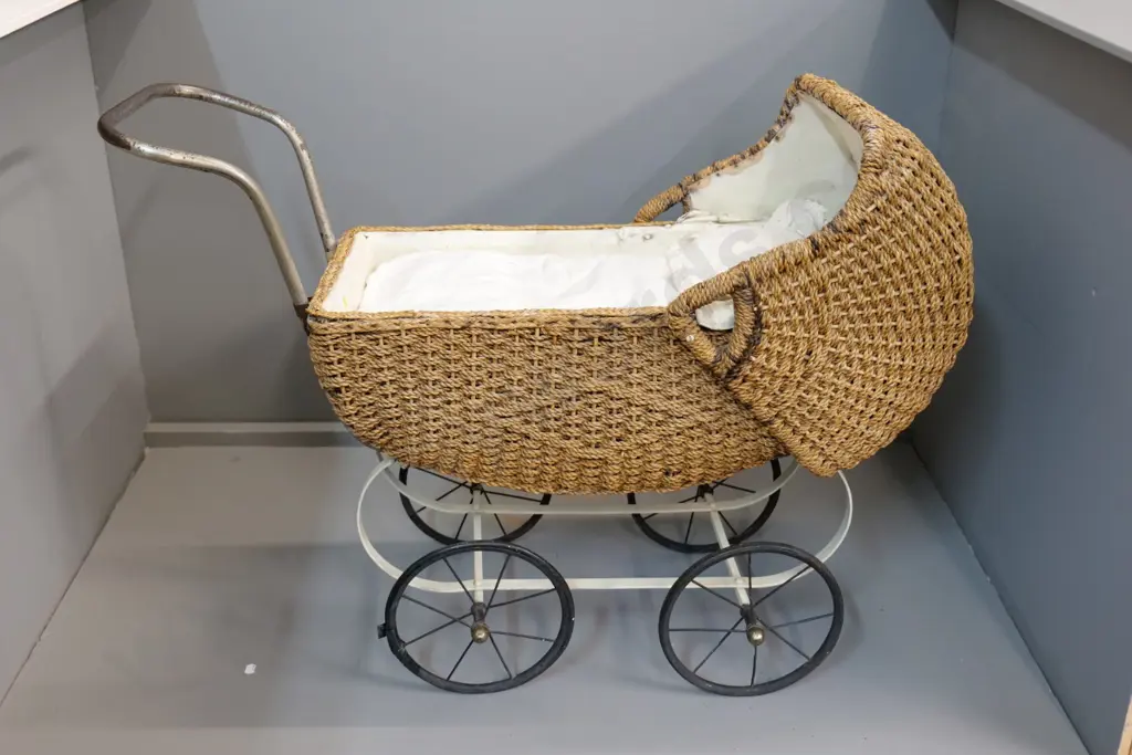 vintage seagrass doll's pram with metal wheels and frame, w/bedding - general wear, strap for hood needs attention L870 Image 1++