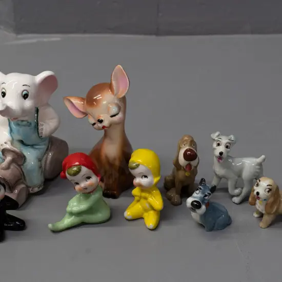 assorted figurines including 4 Wade Lady & The Tramp dog figures, elephant on steamroller, pixies, cat H-95