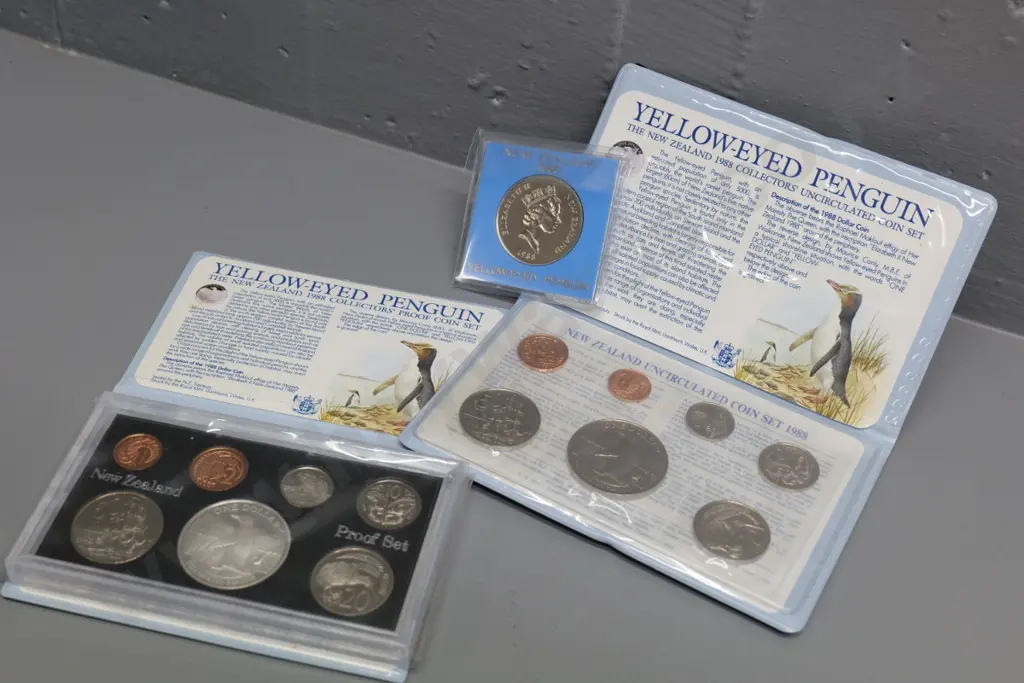 three 1988 Yellow Eyed Penguin New Zealand collector's coin items - dollar coin, uncirculated & proof sets Image 1++