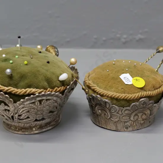 2 vintage pin cushions with pierced metal (silver?) holders and a few odd pins - larger is H-80 D-110 at widest