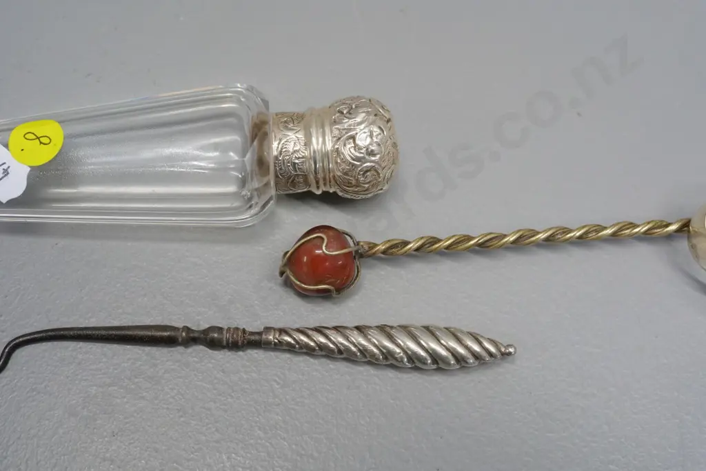 glass scent bottle with sterling silver cap, plated button hook, sugar tongs & Brazil coin spoon with agate in handle Image 1++
