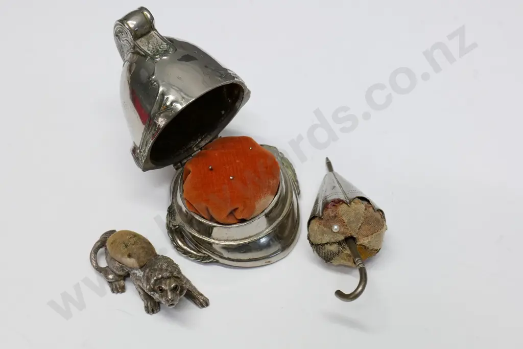 3 vintage novelty metal pin cushions - largest is hinged fireman's helmet 100 x 100, wear to fabric Image 1++