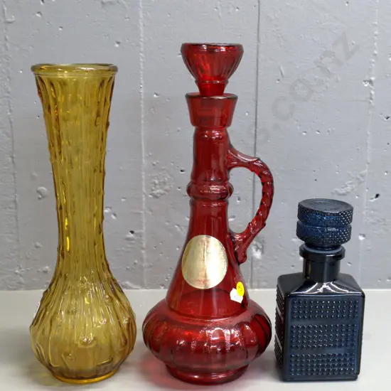retro coloured glass items - red Jim Beam stoppered decanter H330, small dark blue stoppered bottle, and an amber vase