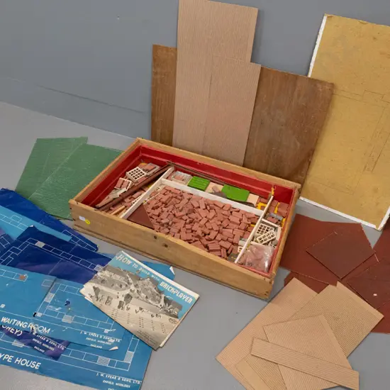 vintage Brickplayer building toy set with terracotta bricks, cardboard roof sections, blueprints, booklet etc.