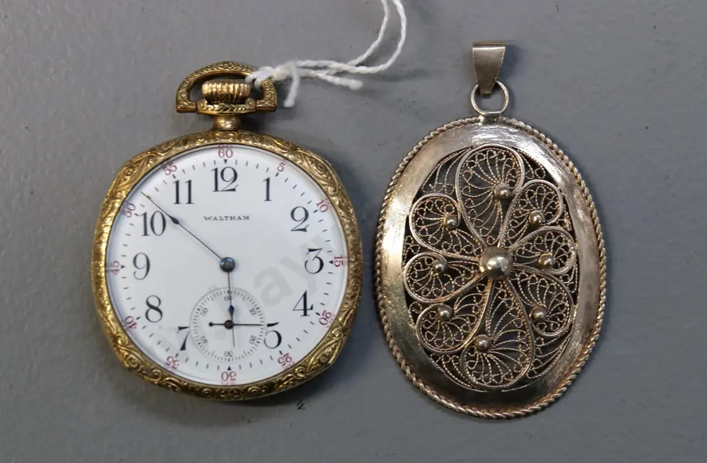 vintage Waltham pocket watch in gold metal case and a filigree silver pendant Image 1++