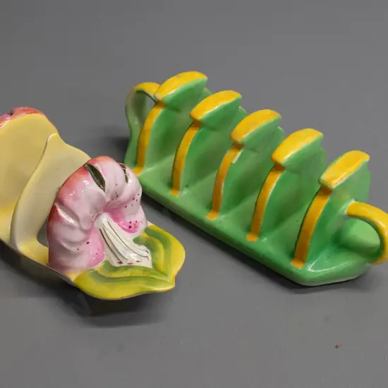 2 toast racks - Royal Winton lily pattern & one unmarked English green & yellow, has small chip to base