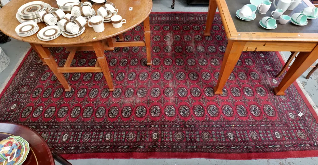 hand-knotted wool Persian style floor rug - red, browns and black - areas of significant wear L-3180 W-2170 Image 1++