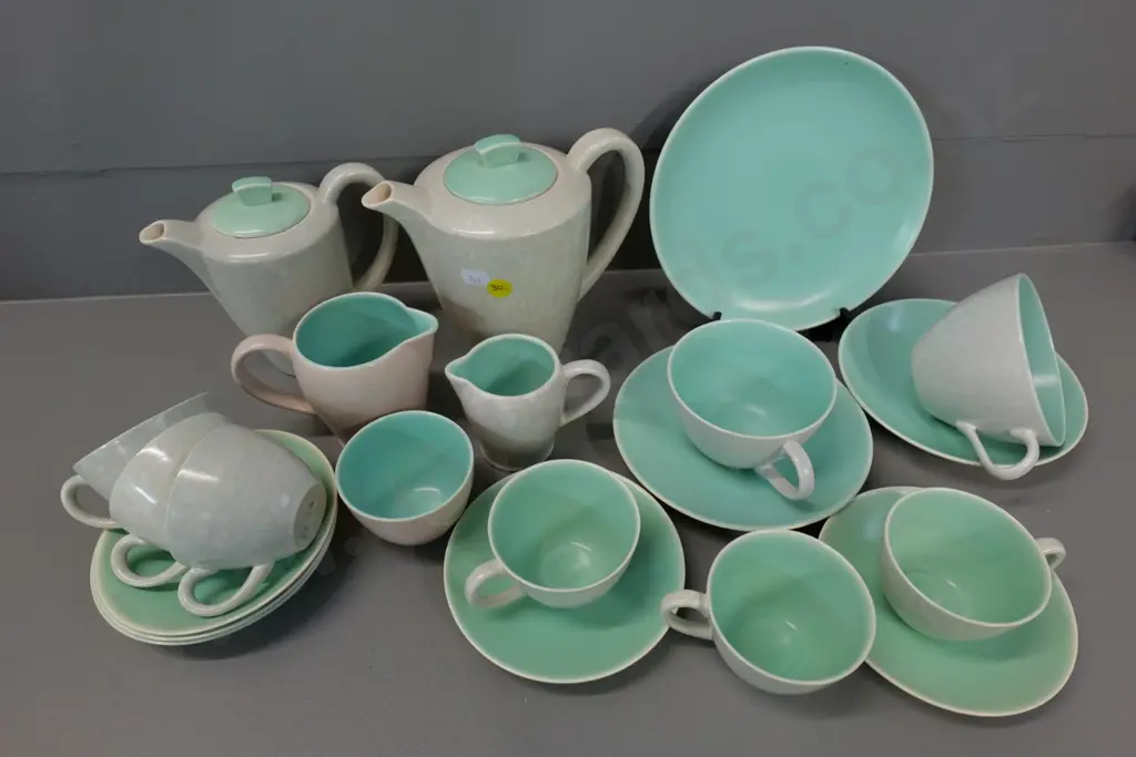 assorted Poole teaware including coffee pot, water jug, 2 creamers, plate & various tea & coffee cups & saucers Image 1++
