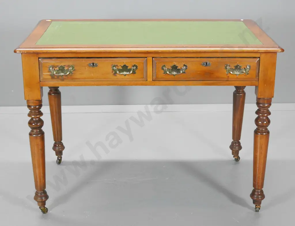 vintage kauri small writing desk w/tooled leather inset, 2 drawers with brass handles, on metal casters H760 W1060 D680 Image 1++