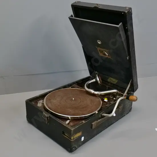 His Master's Voice portable wind-up gramophone with packet of needles - going condition