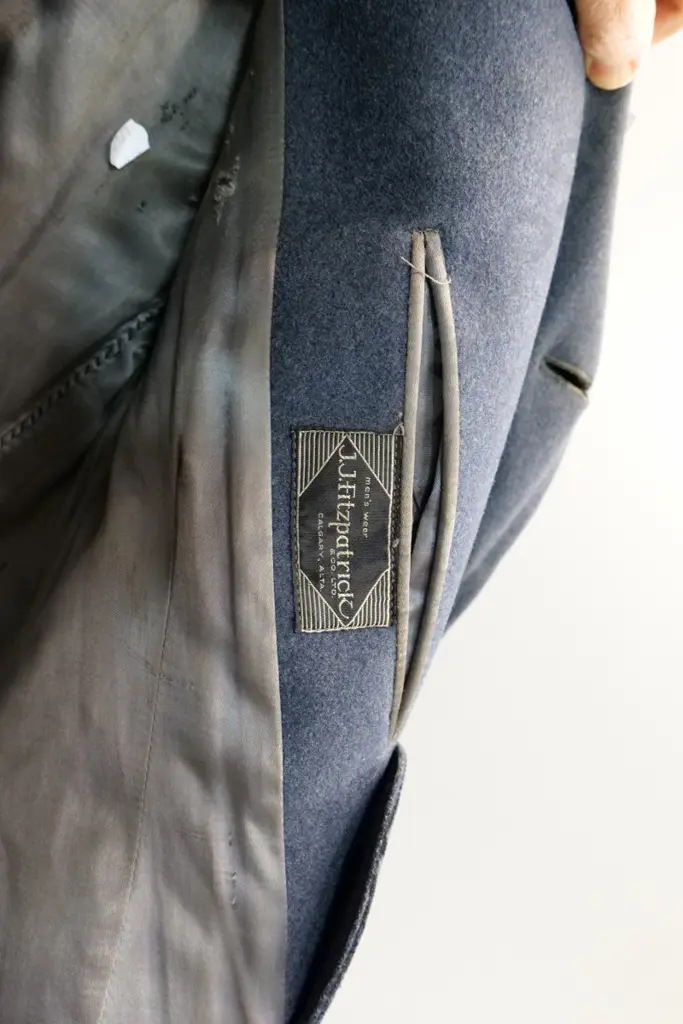 2 WWII RNZAF uniform items - jacket with belt and greatcoat, both need a clean Image 1++