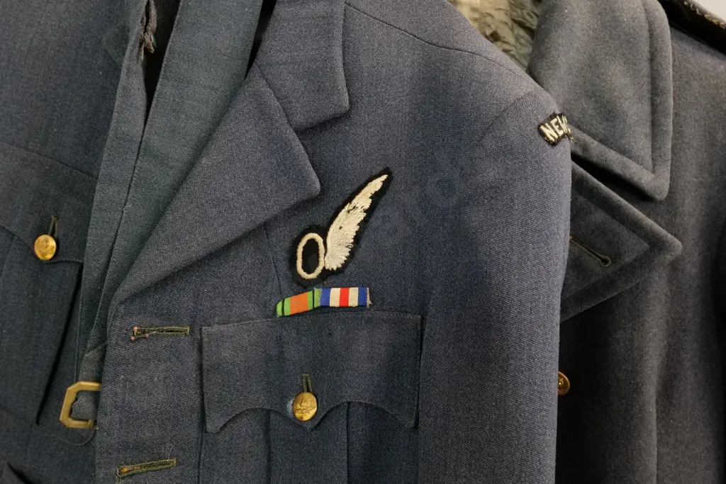 2 WWII RNZAF uniform items - jacket with belt and greatcoat, both need a clean Image 1++