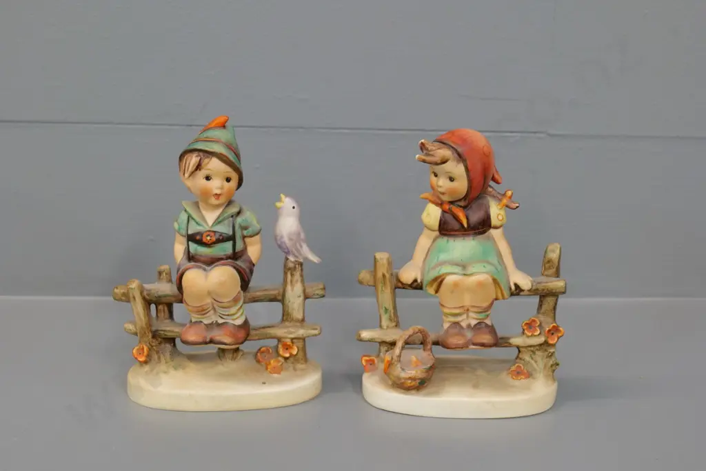 2 Goebel Hummel figurines - boy & girl sitting on fence H-130 Image 1++