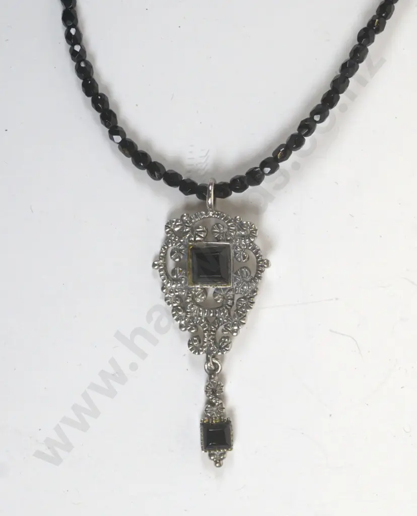 silver pendant on black beaded necklace stamped 925 Image 1++