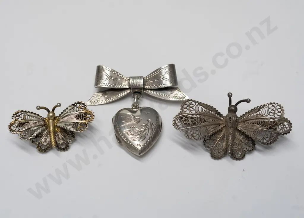2 butterfly brooches & bow with locket brooch Image 1++