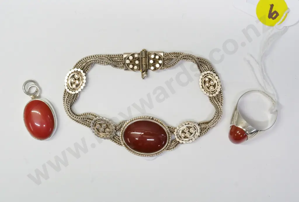 silver and dull red stone items - bracelet marked 900, ring and small pendant Image 1++
