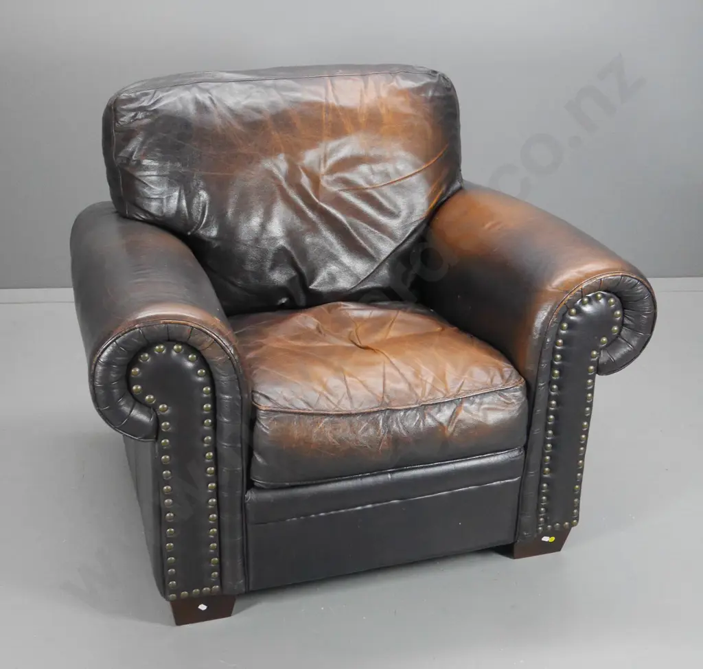 club style antiqued finish leather armchair w/ large stud facings, rubbing to sides H950 W1060 D940 Image 1++